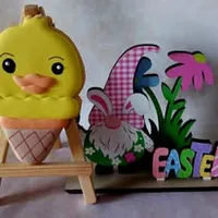 Cute yellow chick in an ice cream cone iced cookie